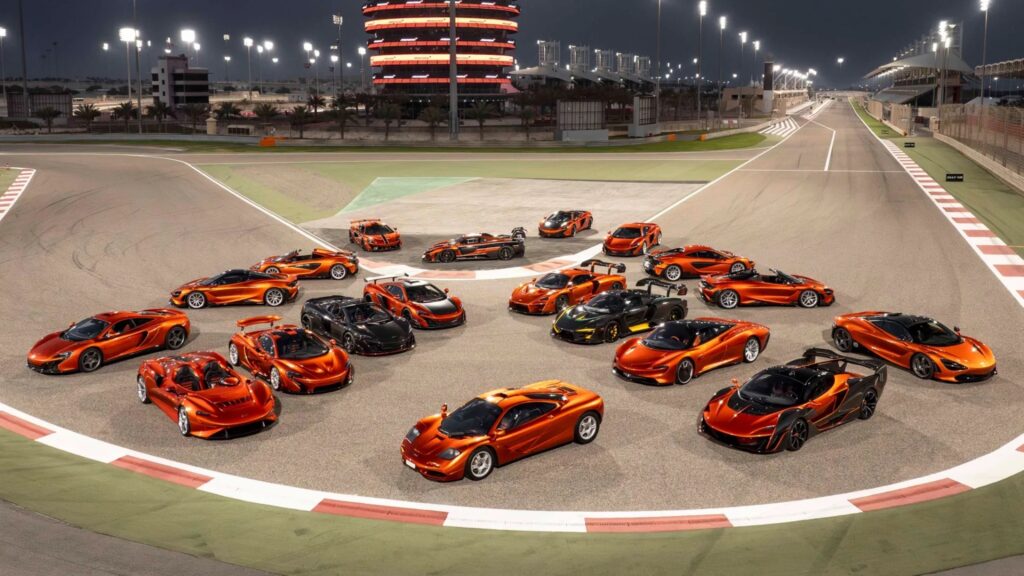 Aerial drone view of Mansour Ojjeh’s McLaren road car collection displayed on a Bahrain circuit