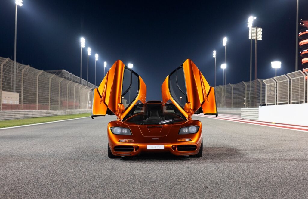 Front view of McLaren F1 with both dihedral doors open