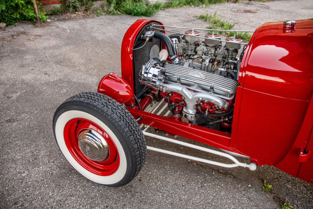 Chevy 283 V8 engine with Edelbrock triple carburetors in a 1928 Ford Model A hot rod