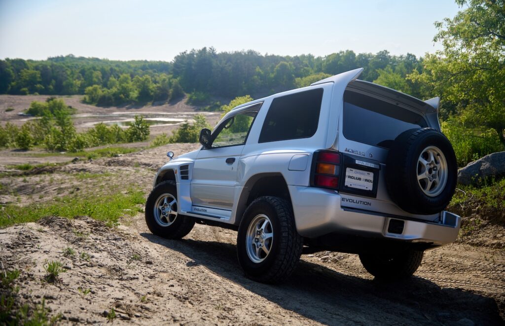 Mitsubishi Pajero Evolution driving through sand dunes during off-road test