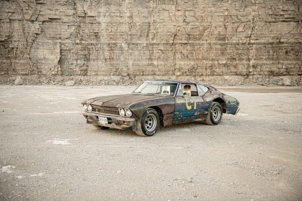 Front three-quarter view of weathered 1968 Chevrolet Chevelle race car in quarry