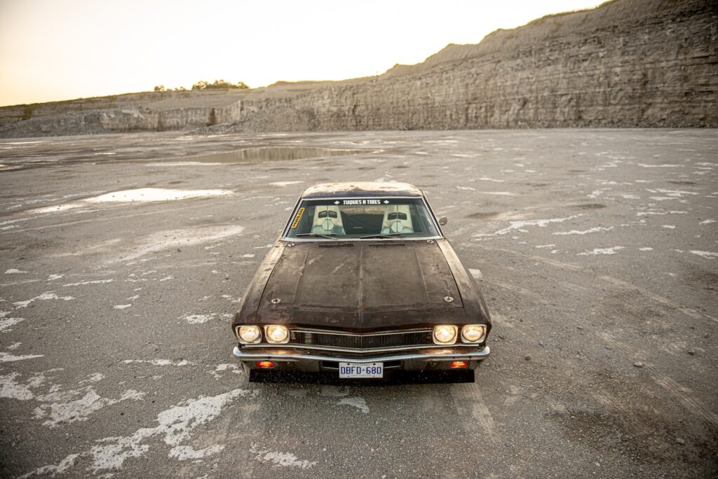 Front view of 1968 Chevrolet Chevelle with headlights illuminated in quarry
