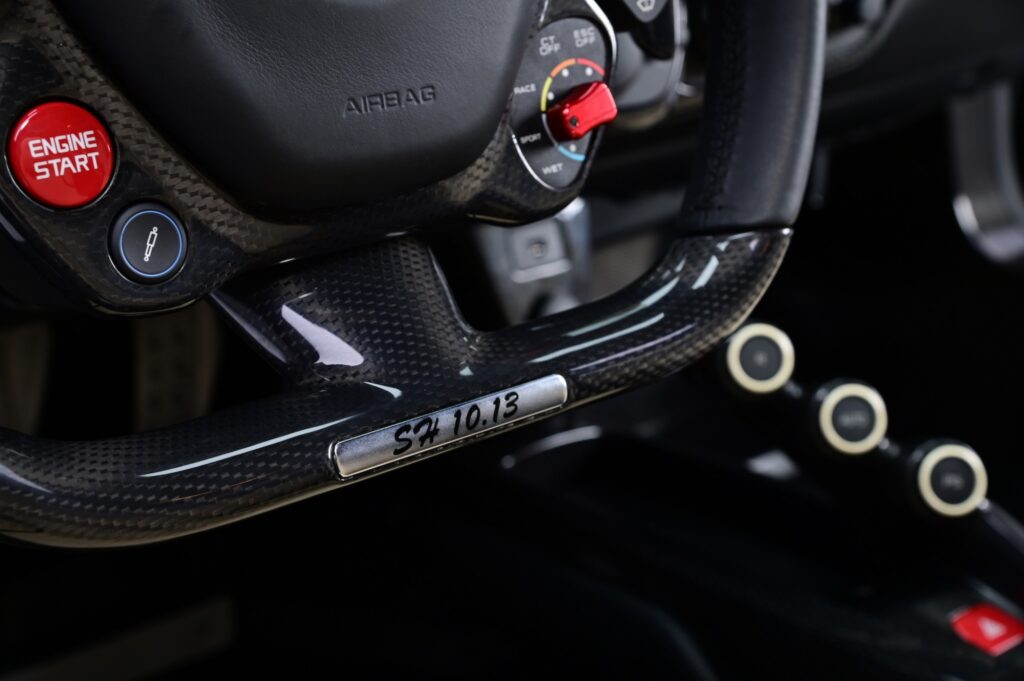Ferrari LaFerrari steering wheel with engine start button.