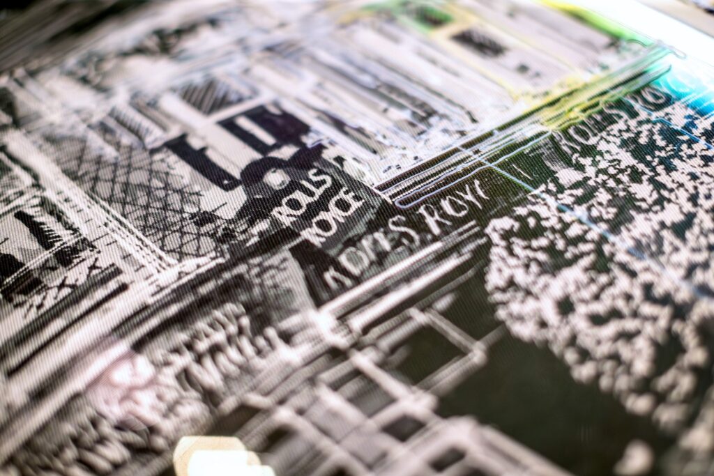 Macro detail of Rolls-Royce couture fabric showing printed cityscape motif