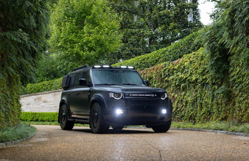 Artemis Automotive Land Rover Defender parked on modern driveway with LED light bar and blacked-out styling