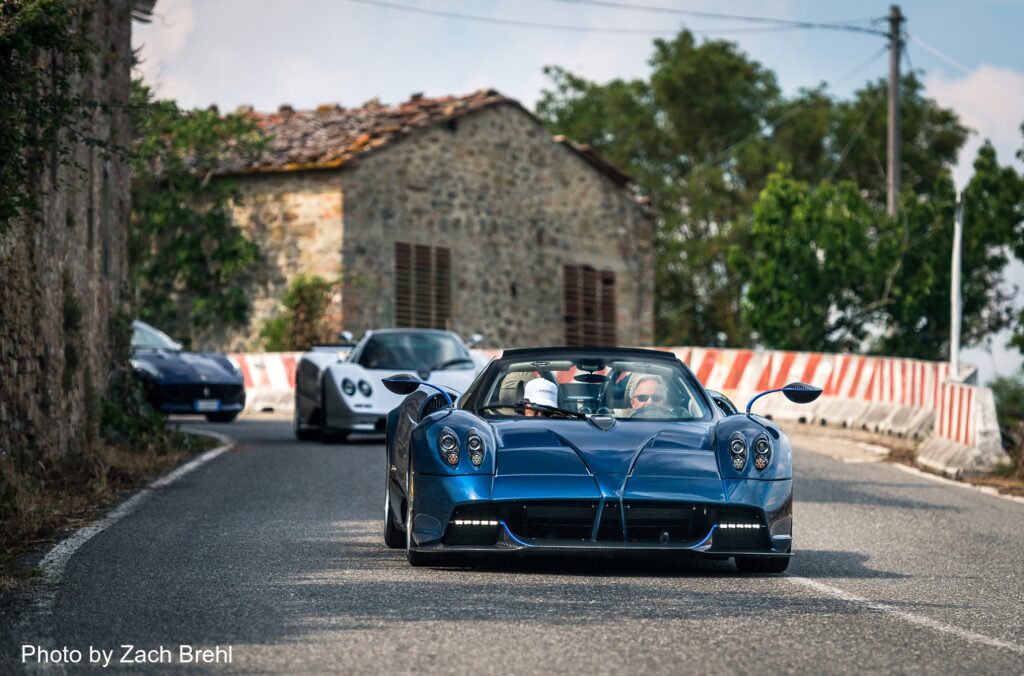 Pagani Huayra Roadster driving on Tuscan countryside road