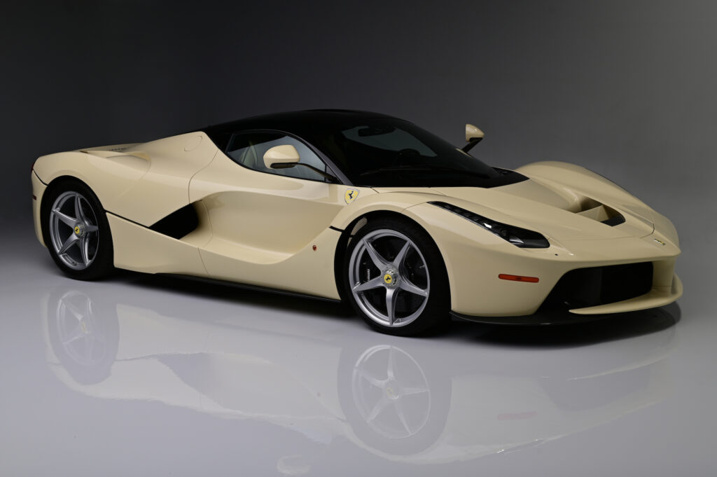 Cream Ferrari LaFerrari photographed from front three-quarter angle.
