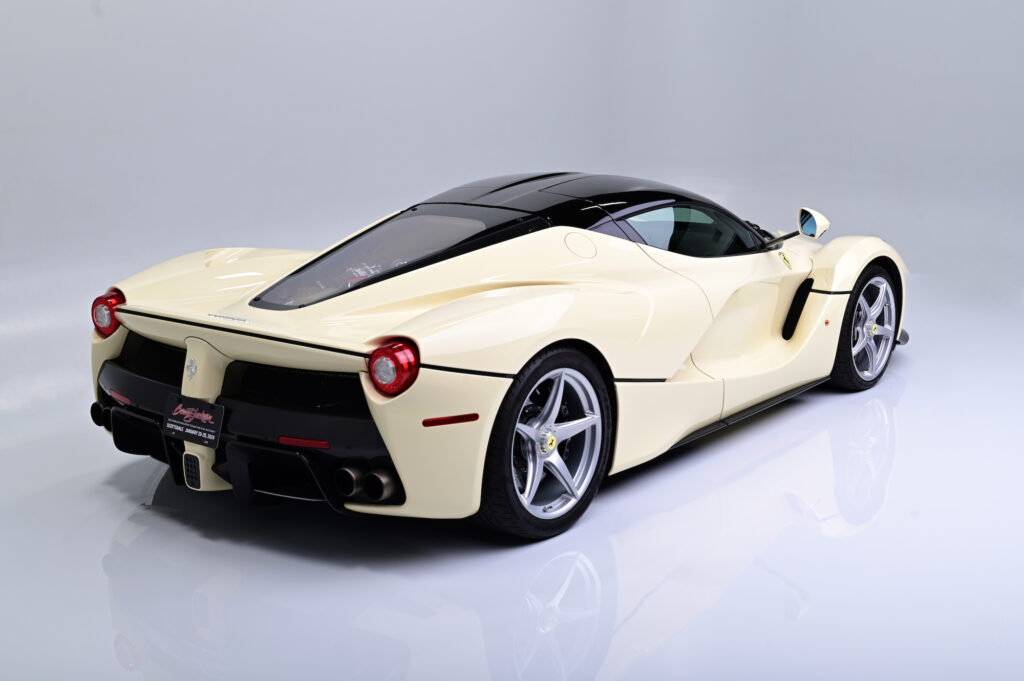 Rear three-quarter view of a cream Ferrari LaFerrari.