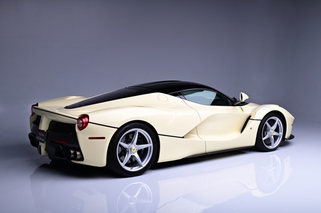 Rear three-quarter view of a cream Ferrari LaFerrari.