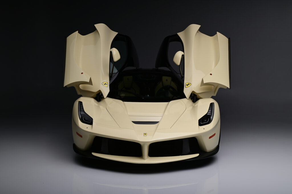 Ferrari LaFerrari with butterfly doors open from front view.