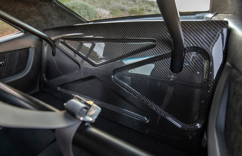 Exposed carbon fiber rear interior panel inside 1969 Camaro restomod