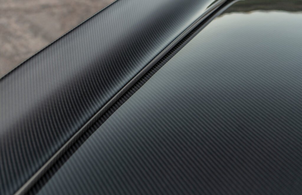 Close-up of exposed carbon fiber weave on Finale Speed Camaro body panel