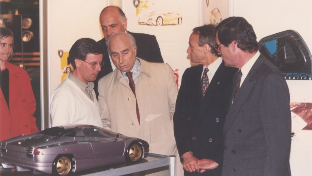 Horacio Pagani and Juan Manuel Fangio with model car