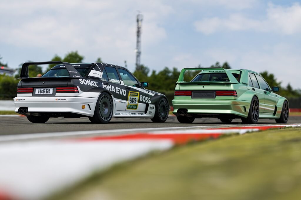 HWA EVO and Mercedes 190E cars on track rear three-quarter