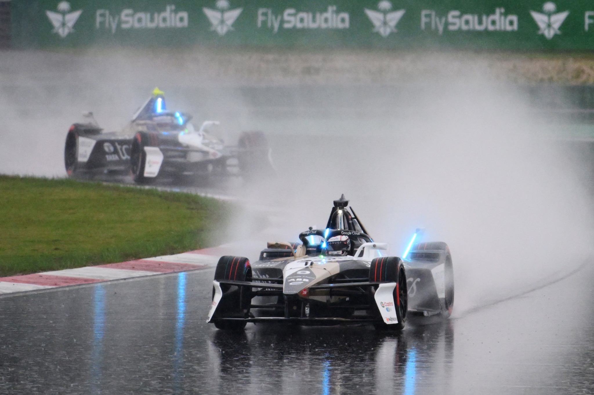 Mitch Evans Jaguar Formula E car throwing spray in wet Jakarta E-Prix race 2025