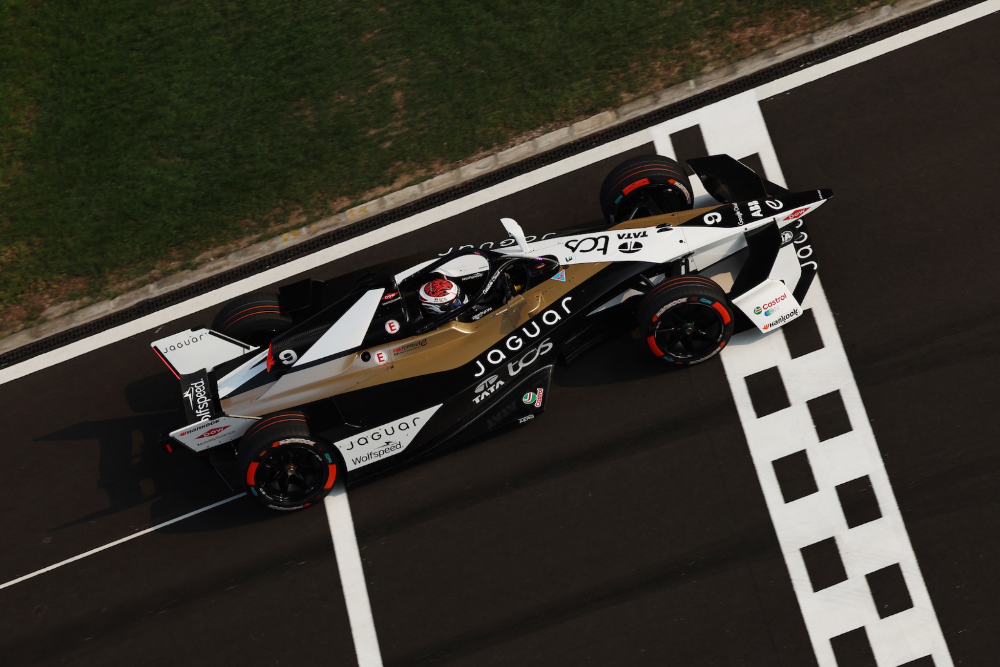 Rear three-quarter view of Mitch Evans Jaguar Formula E car in wet Jakarta race 2025