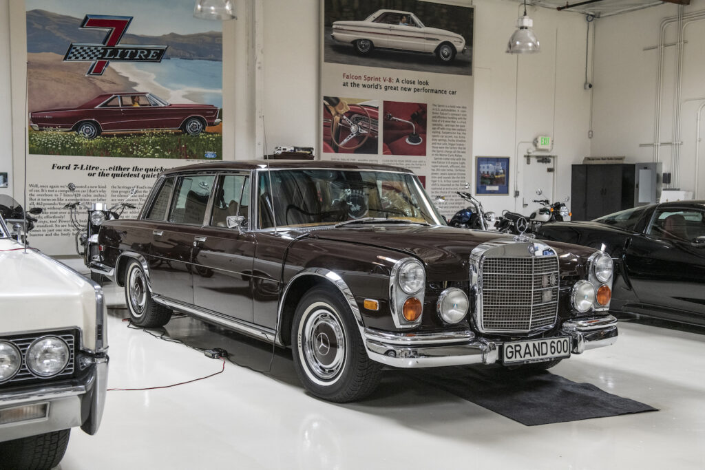 Dark classic Mercedes front view in Jay Leno garage