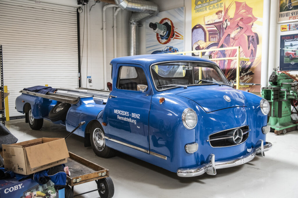 Blue vintage truck inside Jay Leno garage