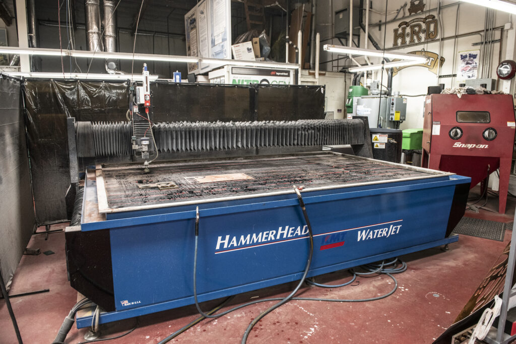 Fabrication area waterjet machine in Jay Leno garage
