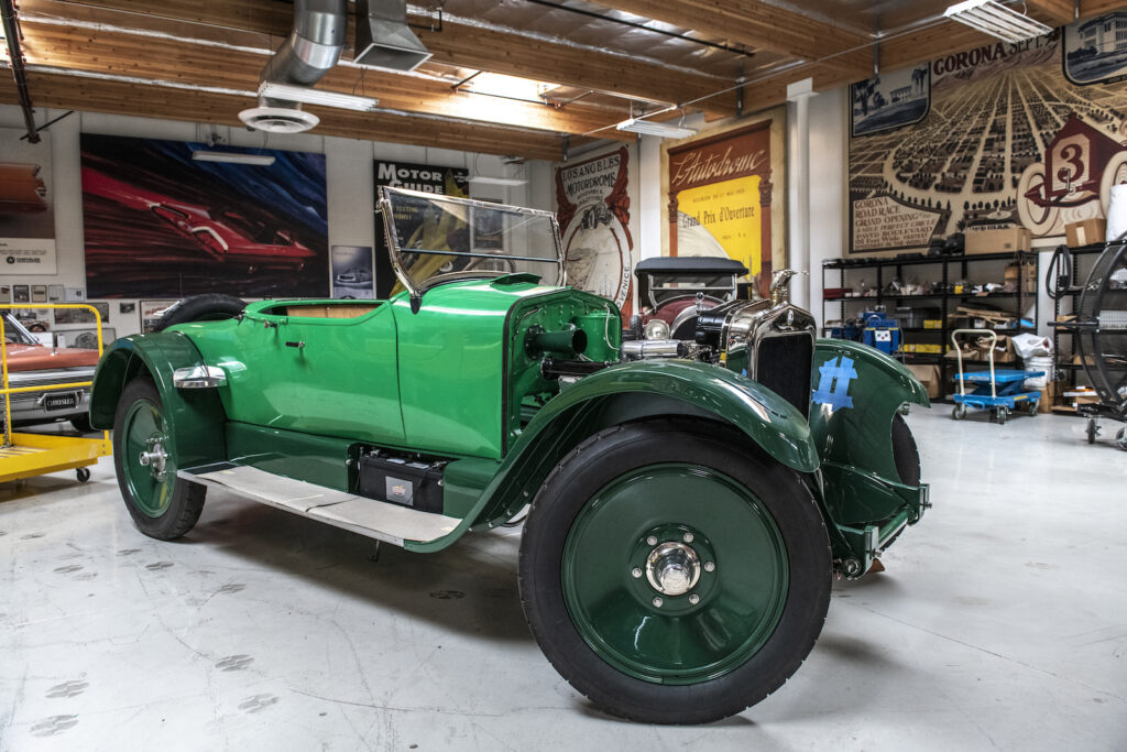 Green vintage car in Jay Leno garage