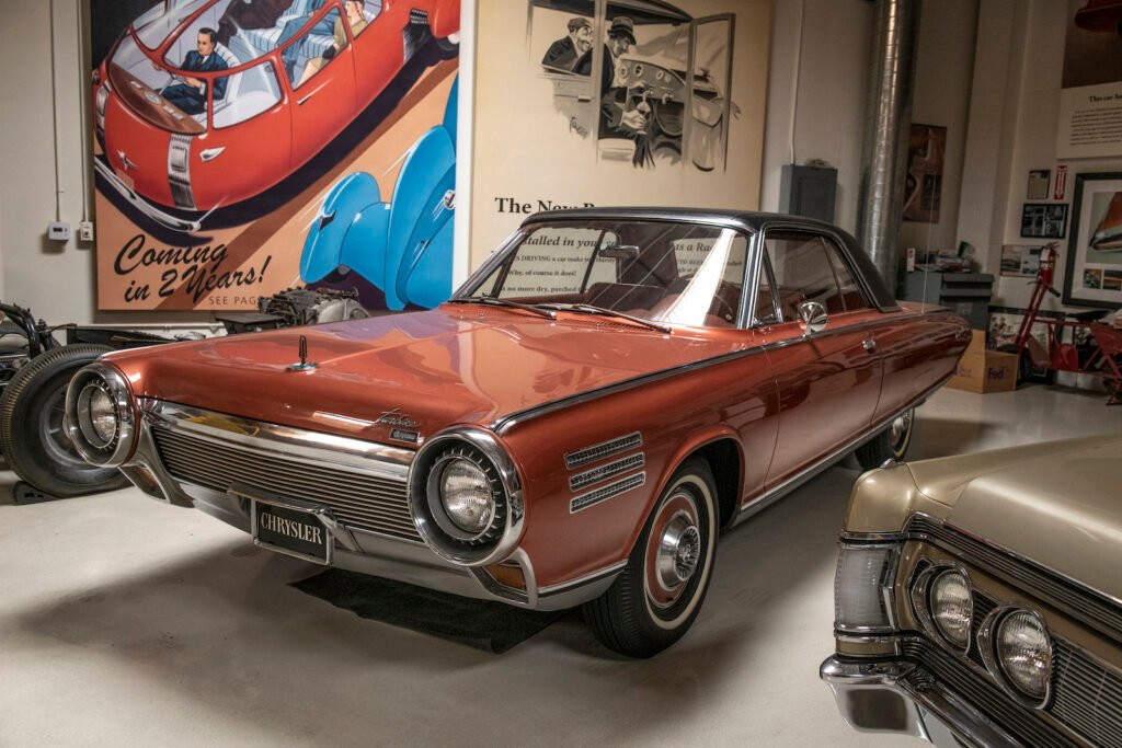 Red classic coupe in Jay Leno garage