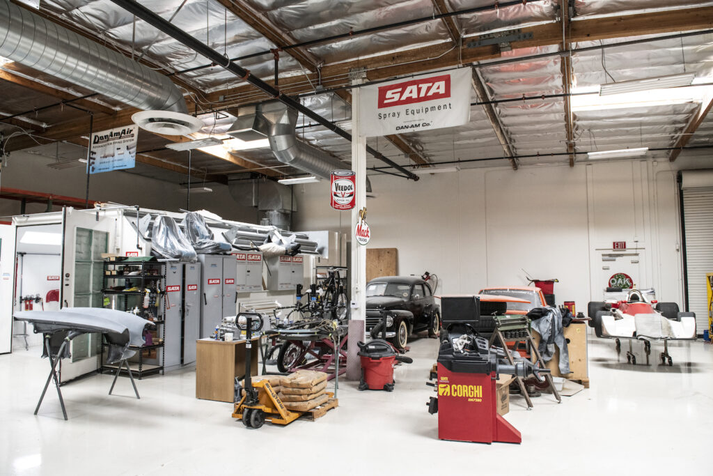 Wide view of restoration area inside Jay Leno garage