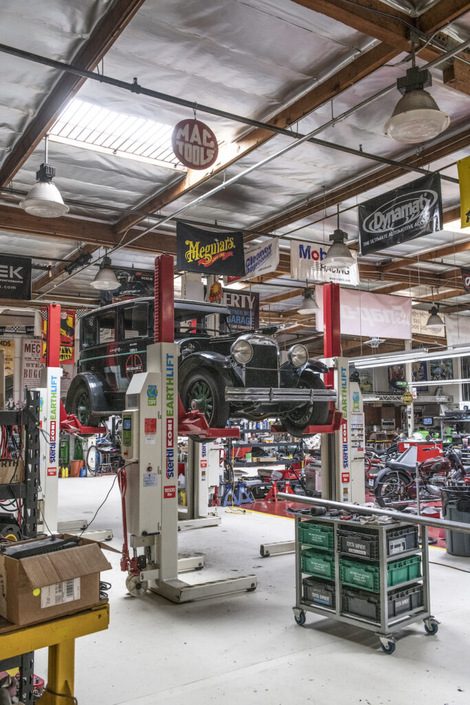 Restoration shop floor with classic cars in Jay Leno garage
