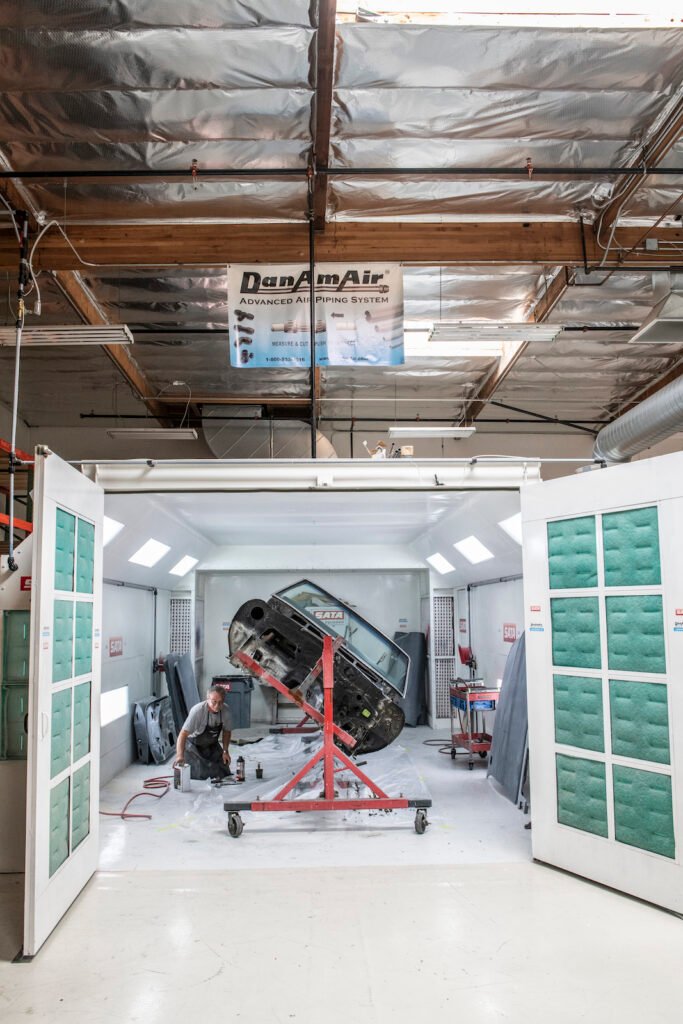 technician working in Jay Leno's private car collection garage