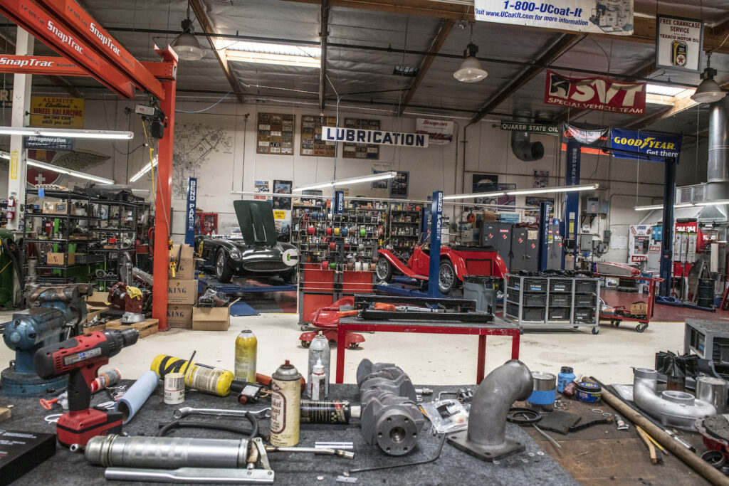 Restoration shop floor with classic cars in Jay Leno garage