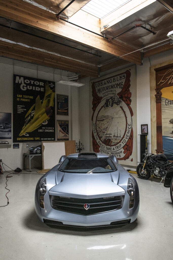 Silver concept car front view in Jay Leno garage