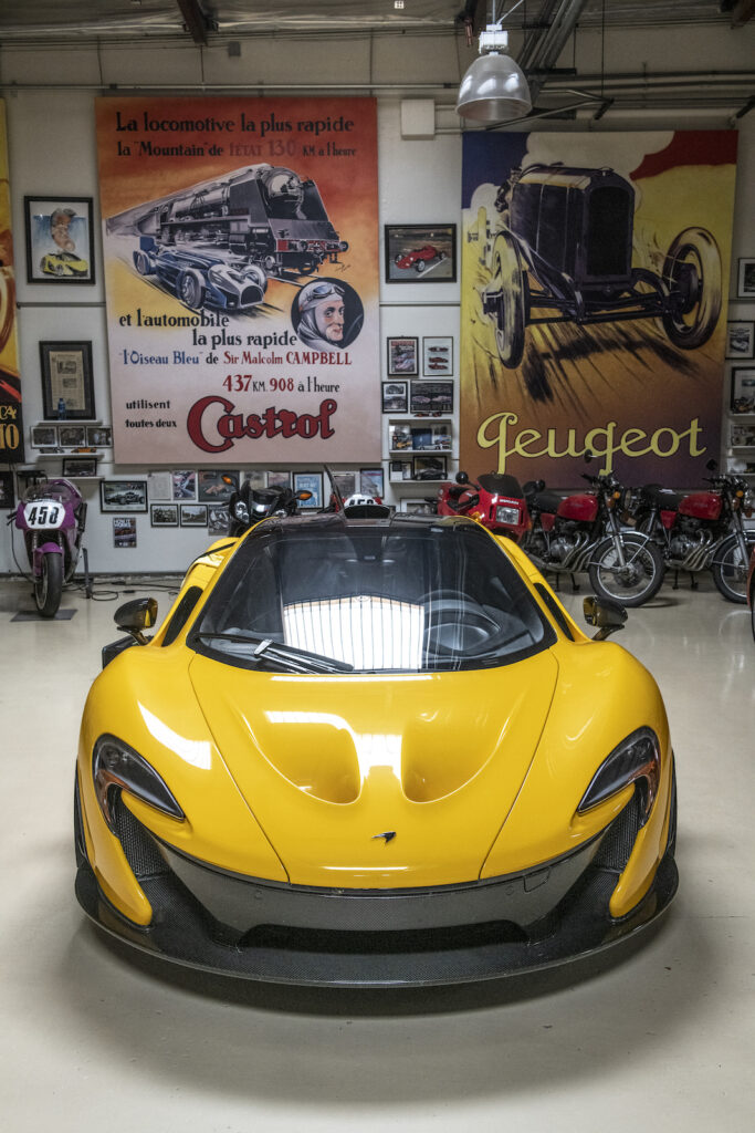 Yellow McLaren front view in Jay Leno garage