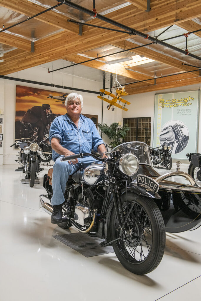 Jay Leno on vintage police motorcycle front view