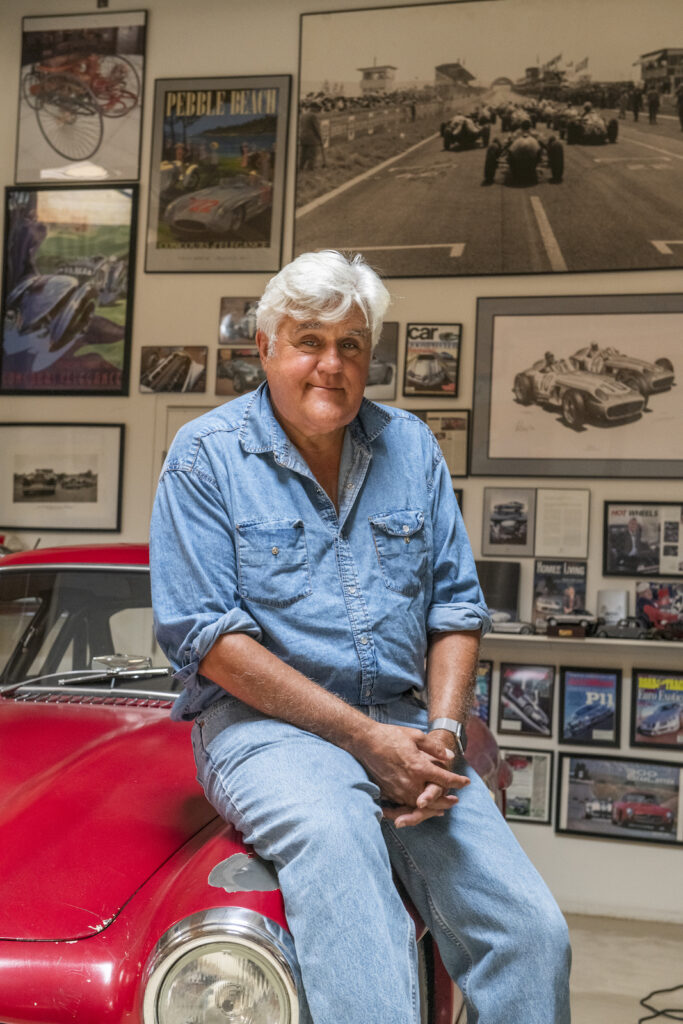 Jay Leno portrait on red Mercedes roadster