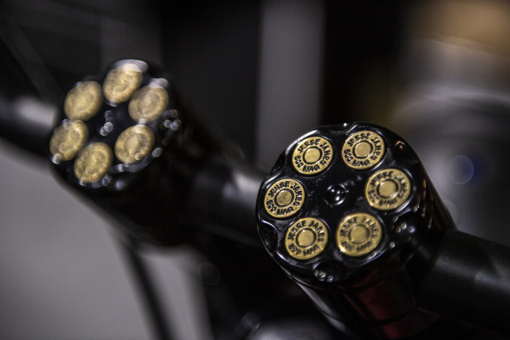 Custom revolver-cylinder style motorcycle handle detail designed by Jesse James.