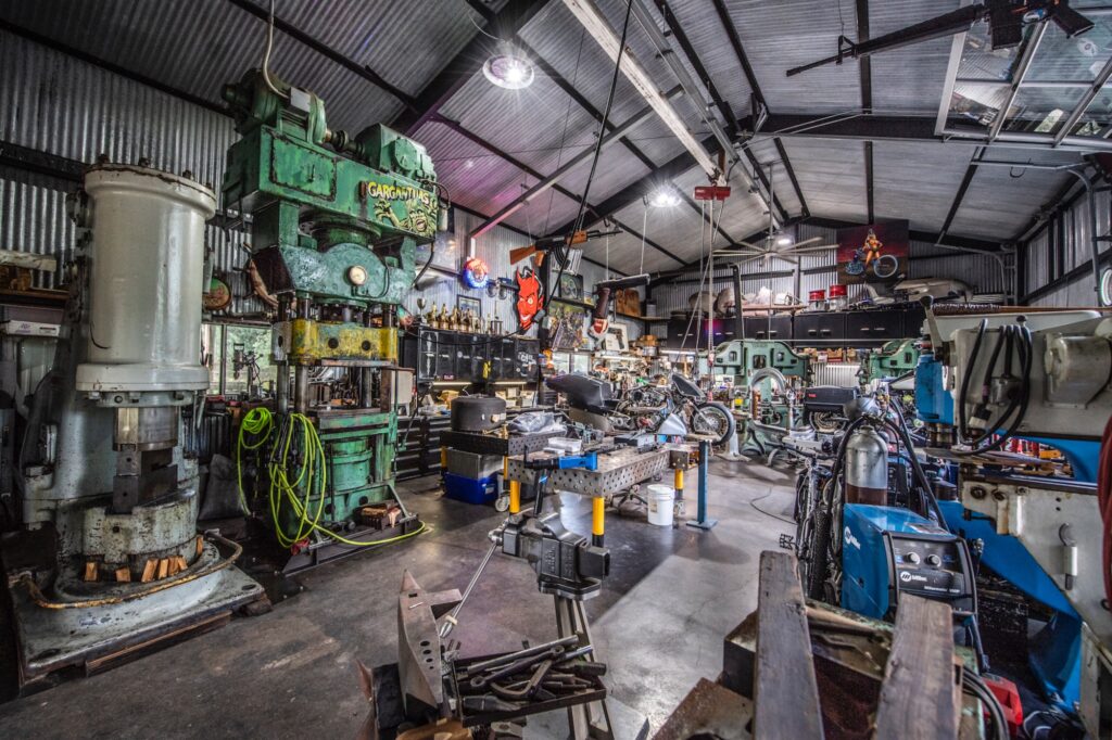 Wide interior view of Jesse James’ custom motorcycle fabrication shop
