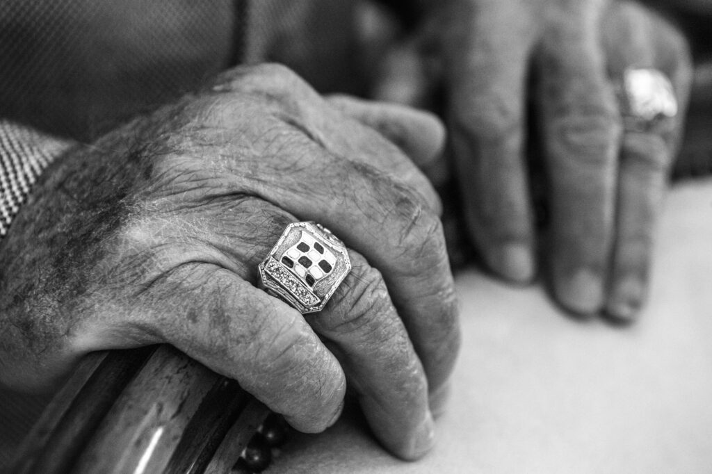 Close-up of Mario Andretti’s hands resting