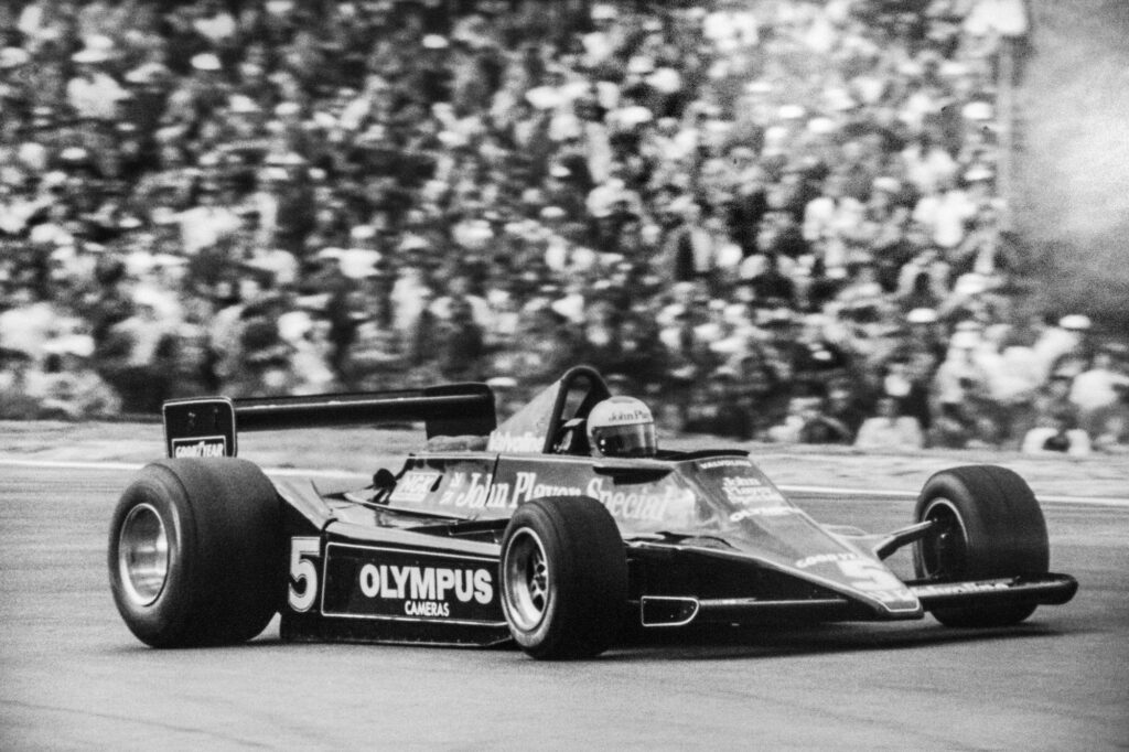 Mario Andretti in Olympus-sponsored Indy car race action