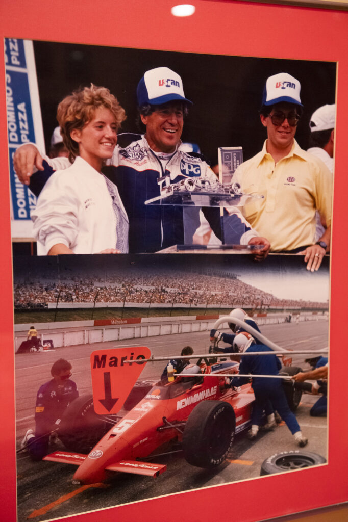 Archival photo of Mario Andretti in victory lane on the podium