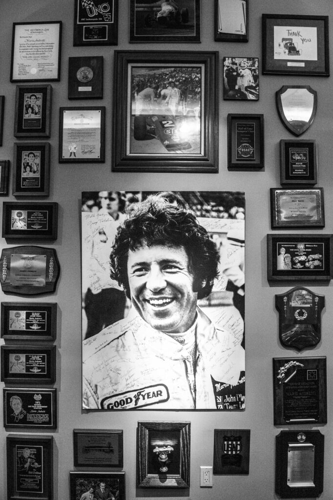 Mario Andretti wall portrait and memorabilia display