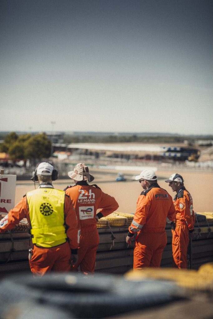 Track marshals watch the circuit during the Peter Auto Classic Le Mans event