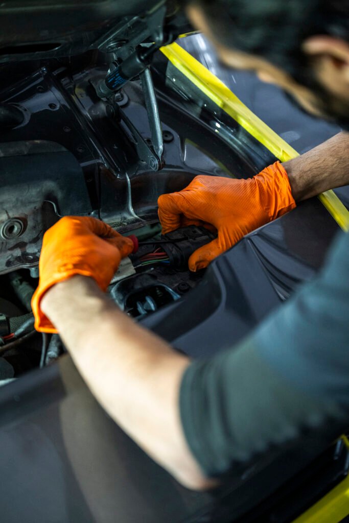 Technician hands detail during ducktail installation