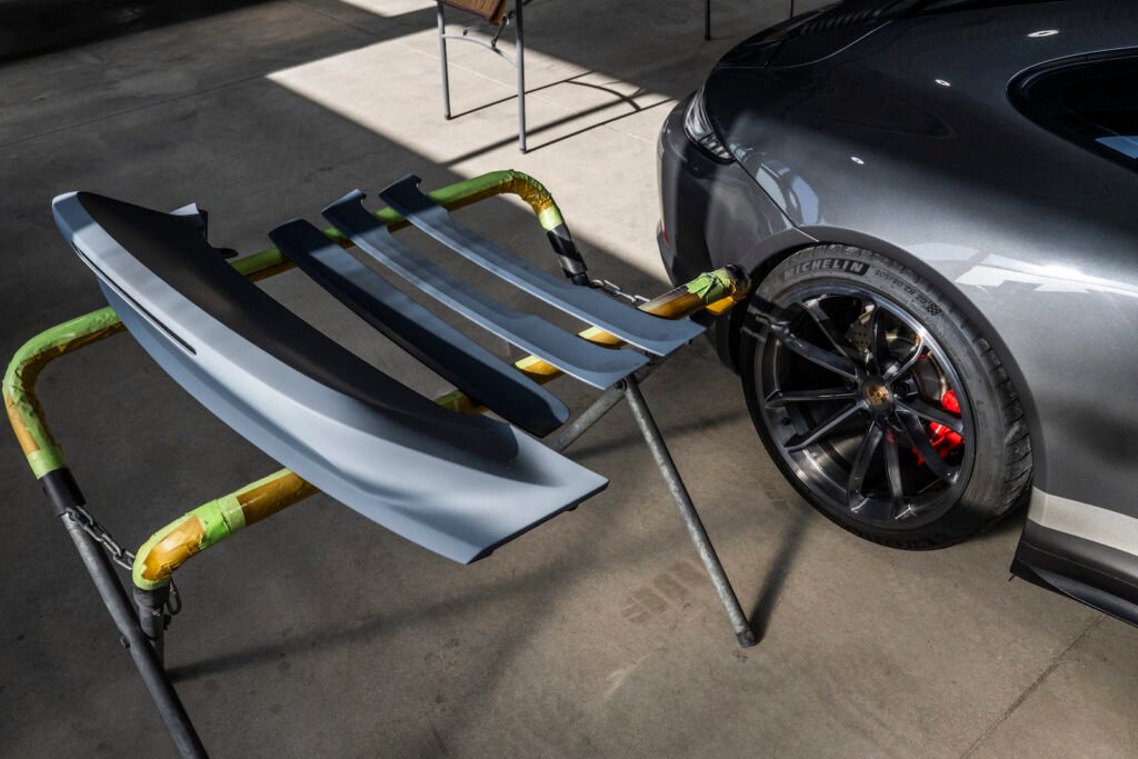 Ducktail spoiler and Porsche 911 Carrera GTS in workshop at European Autoworks