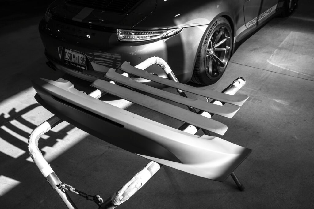 Ducktail spoiler near rear bumper