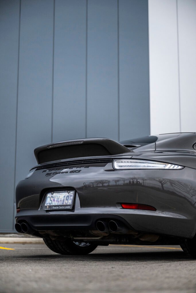 Porsche 911 Carrera GTS rear three-quarter view outdoors