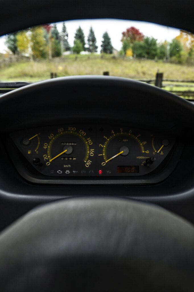 Toyota Sera instrument cluster viewed through steering wheel