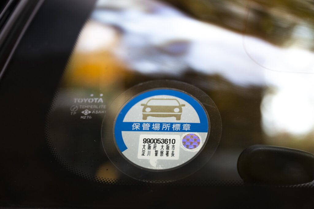 Japanese inspection or information sticker on Toyota Sera window