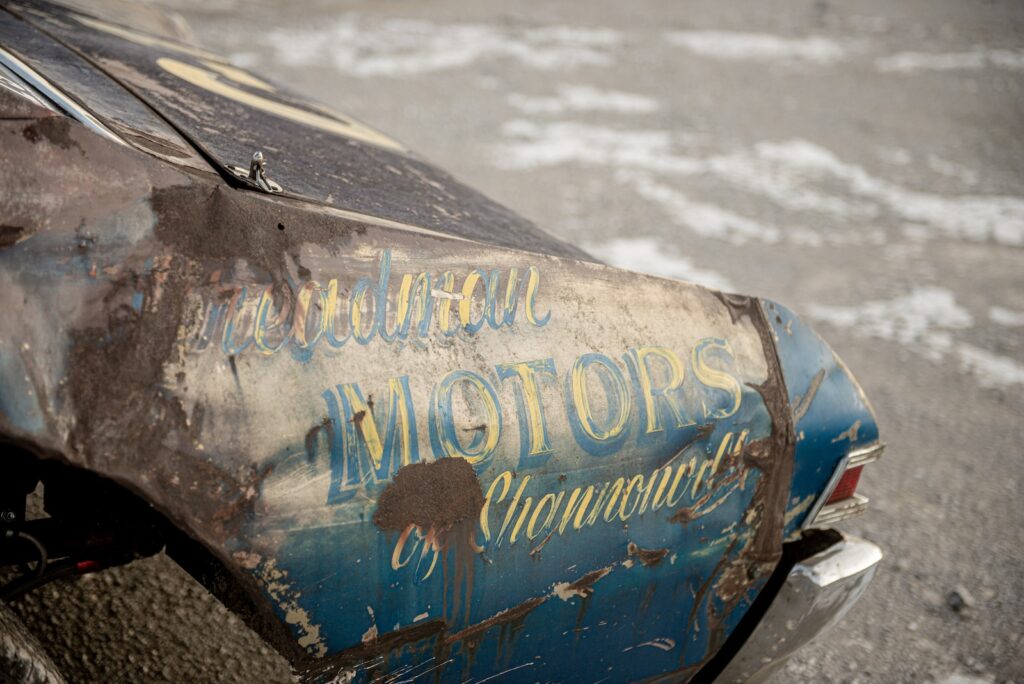 Vintage Motors lettering detail on worn Chevelle quarter panel